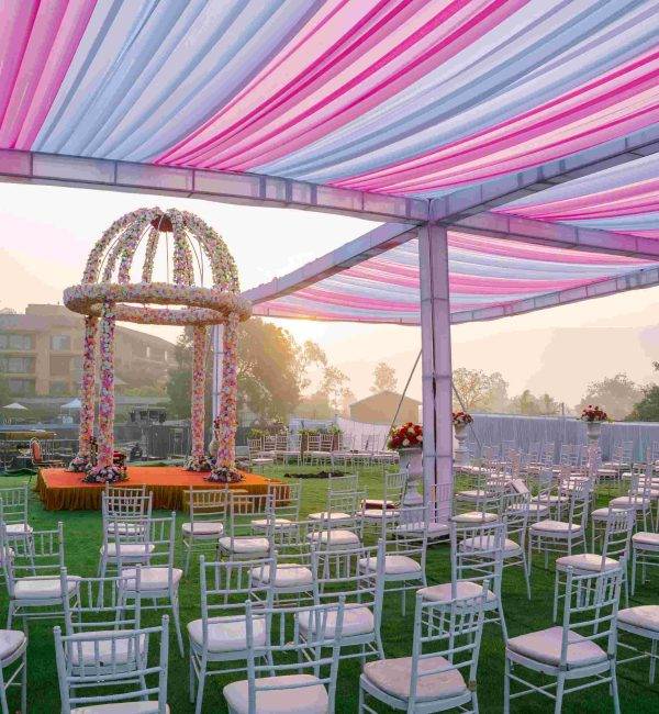 Pink pastel lounge seating under a tent